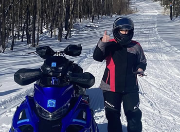 home-snowmobile-thumbs-up